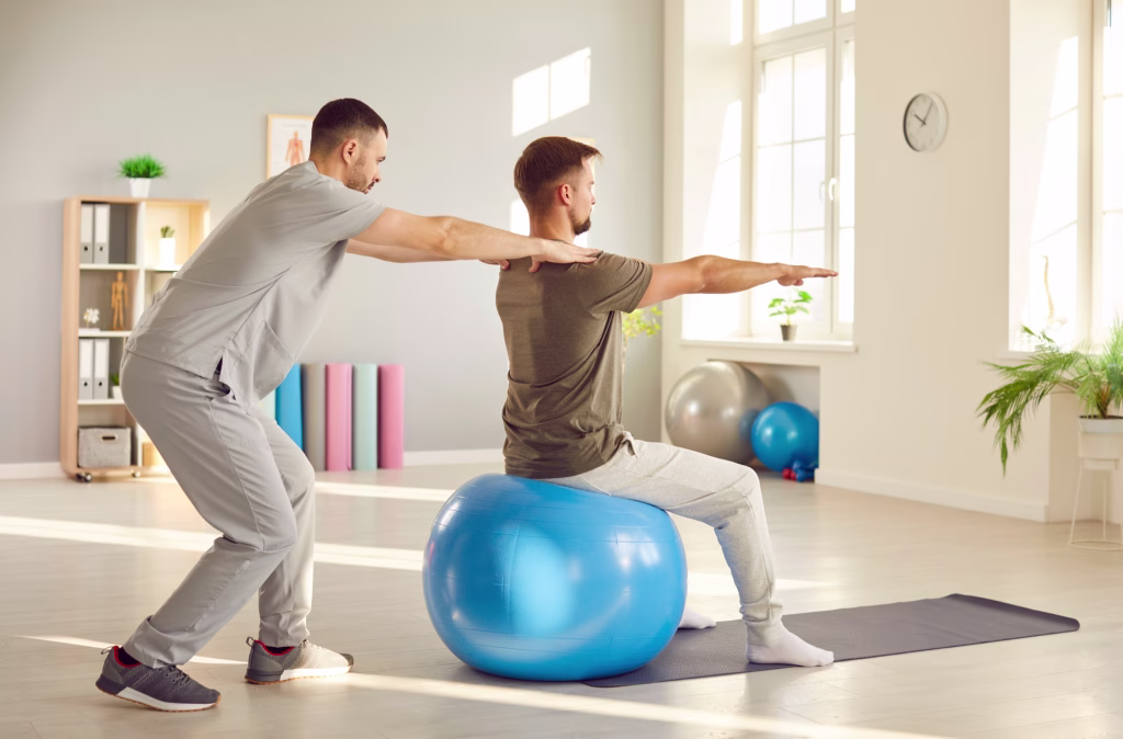 Exercise physiologist guiding a client through a balance exercise