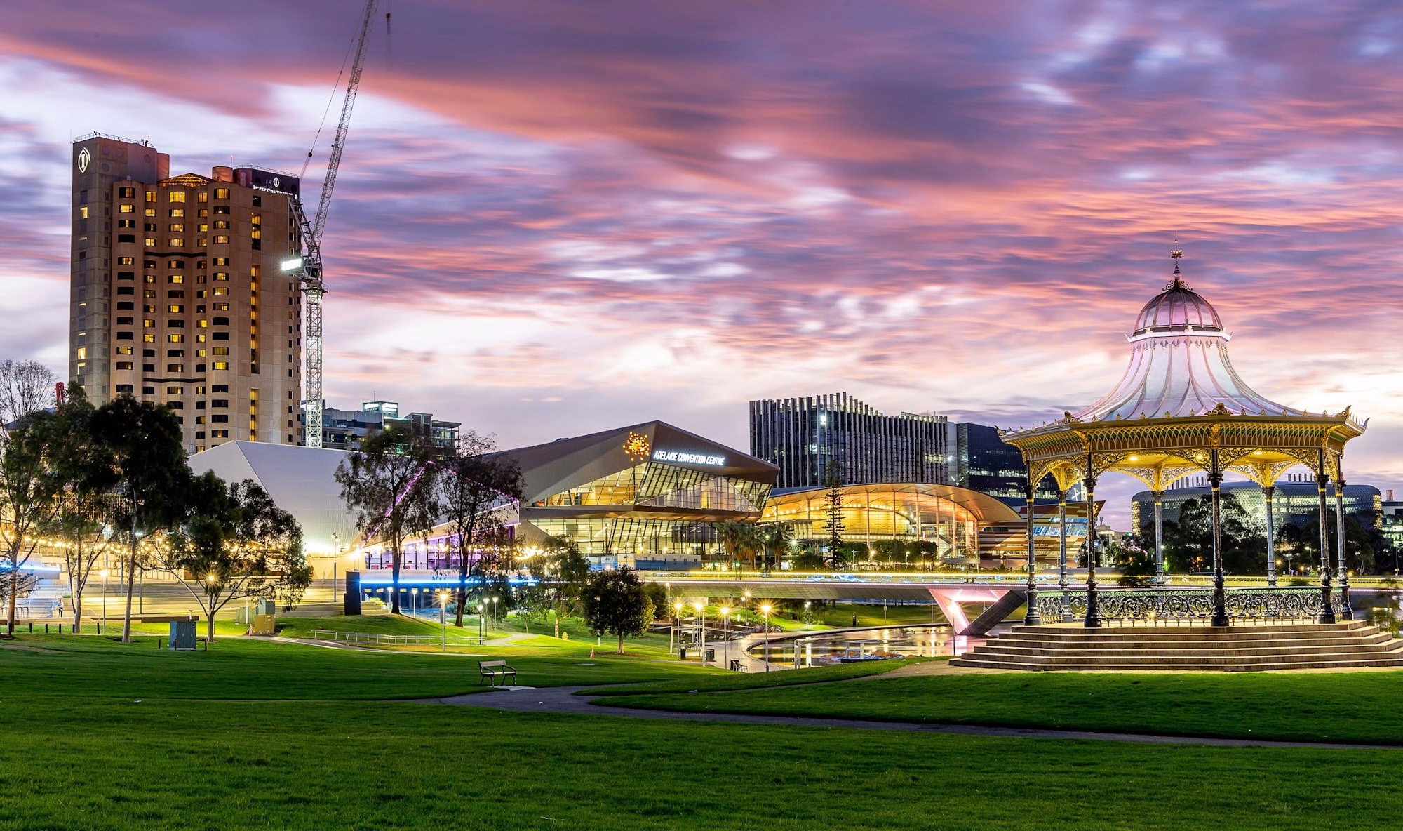 Adelaide riverbank and city buildings at dusk